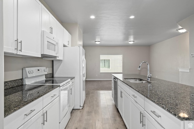 14728 S Rising Star Way W, Bluffdale, UT 84065 - kitchen with white appliances, white cabinetry, light wood-style floors, recessed lighting, and dark stone counters