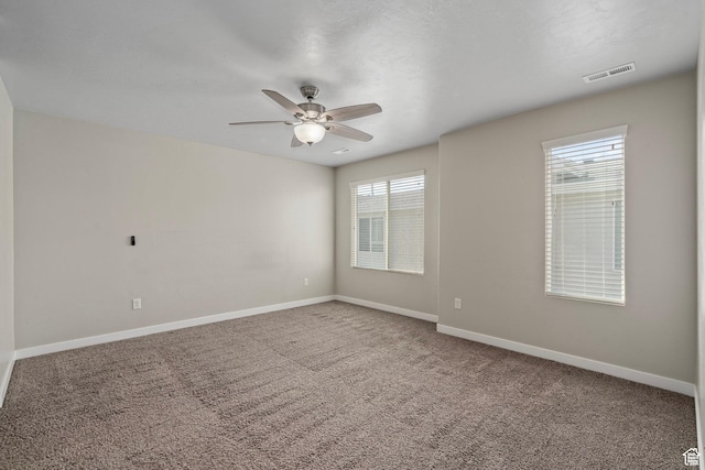 14728 S Rising Star Way W, Bluffdale, UT 84065 - empty room with healthy amount of natural light, ceiling fan, and carpet flooring