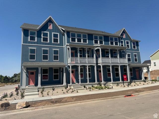 1452 N 1875 W Unit 146, Layton, UT 84041 - view of front of property featuring a porch, a balcony, and board and batten siding