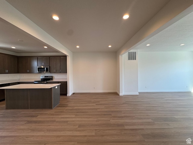 1452 N 1875 W Unit 146, Layton, UT 84041 - kitchen featuring electric range, stainless steel microwave, open floor plan, recessed lighting, and dark brown cabinetry