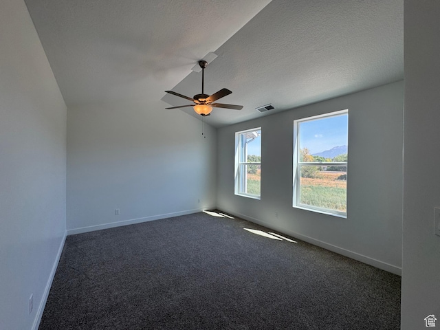 1452 N 1875 W Unit 146, Layton, UT 84041 - unfurnished room with a ceiling fan, dark carpet, lofted ceiling, and a textured ceiling