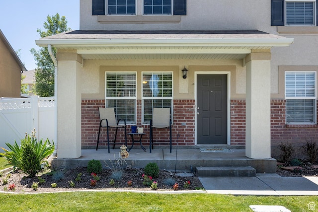 6733 W Mary Leizan Ln, Herriman, UT 84096 - property entrance with covered porch, brick siding, and stucco siding
