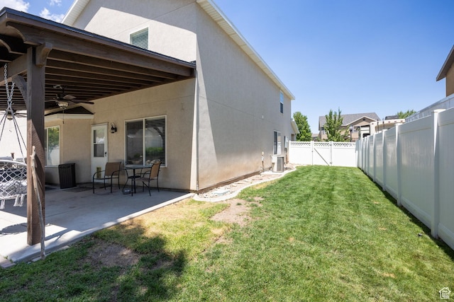 6733 W Mary Leizan Ln, Herriman, UT 84096 - fenced backyard featuring a patio area and ceiling fan
