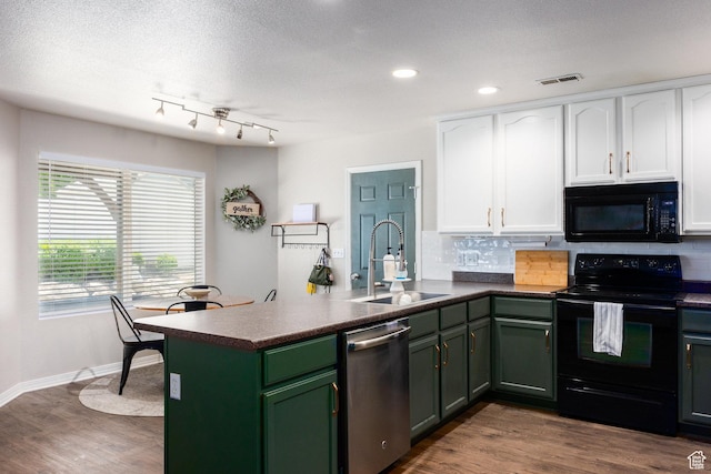 6733 W Mary Leizan Ln, Herriman, UT 84096 - kitchen with black appliances, white cabinets, green cabinets, a peninsula, and backsplash