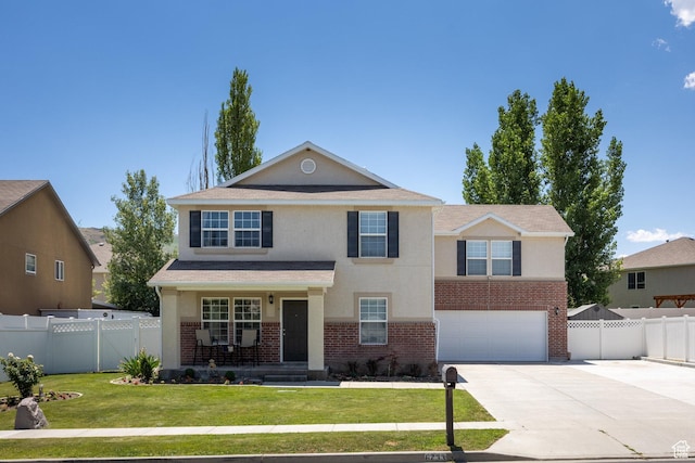 6733 W Mary Leizan Ln, Herriman, UT 84096 - traditional-style home featuring driveway, stucco siding, brick siding, and a garage