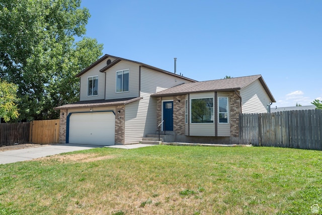 5131 W Parr Dr, West Jordan, UT 84081 - tri-level home featuring an attached garage, driveway, and brick siding