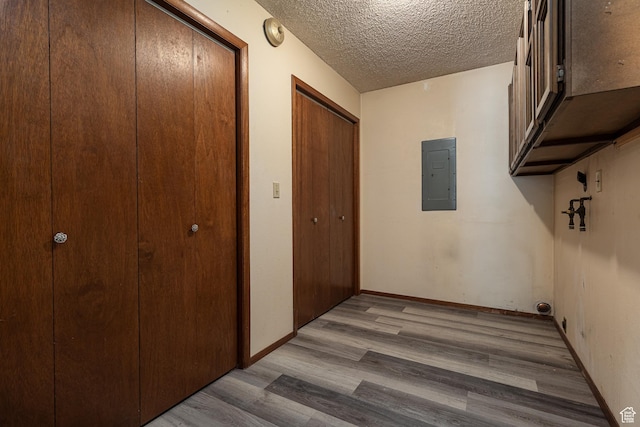 437 S 100 W, Kanab, UT 84741 - corridor featuring electric panel, wood finished floors, and a textured ceiling