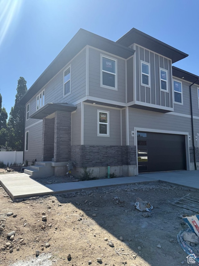 7425 S 410 E, Midvale, UT 84047 - view of front of home featuring an attached garage and concrete driveway