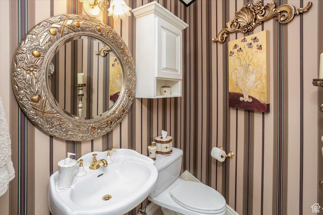 27 Canterbury Ln, Logan, UT 84321 - half bath featuring wallpapered walls and a sink