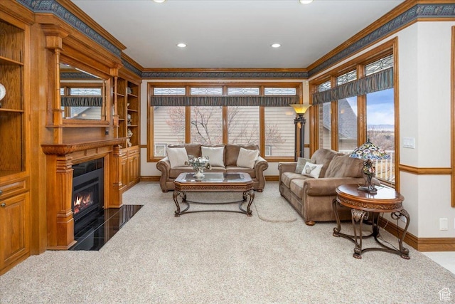 27 Canterbury Ln, Logan, UT 84321 - living room featuring ornamental molding, a fireplace with flush hearth, and recessed lighting