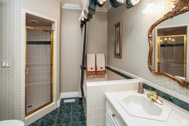 27 Canterbury Ln, Logan, UT 84321 - bathroom with wallpapered walls, a shower stall, vanity, tile patterned floors, and crown molding