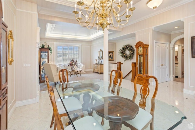 27 Canterbury Ln, Logan, UT 84321 - dining room with arched walkways, crown molding, a chandelier, light tile patterned flooring, and a decorative wall