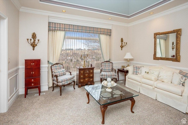 27 Canterbury Ln, Logan, UT 84321 - living area with ornamental molding, carpet, wainscoting, wallpapered walls, and a decorative wall