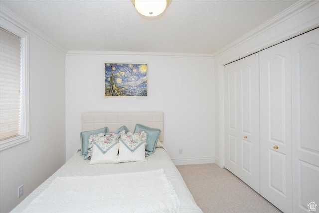 27 Canterbury Ln, Logan, UT 84321 - bedroom with a closet, crown molding, and light colored carpet