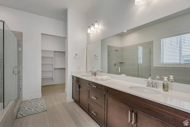 1919 S Sawmill Blvd E, Heber City, UT 84032 - full bathroom featuring a stall shower, double vanity, and a walk in closet