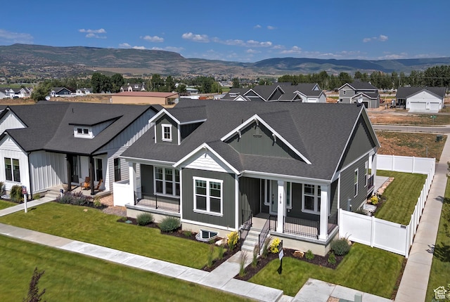 1919 S Sawmill Blvd E, Heber City, UT 84032 - view of front of property featuring a porch, a mountain view, roof with shingles, and a residential view