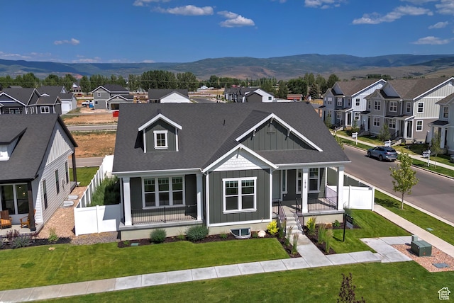 1919 S Sawmill Blvd E, Heber City, UT 84032 - view of front of home featuring board and batten siding, a porch, a residential view, and a mountain view