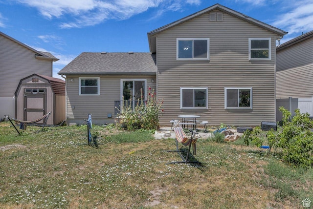 158 N Walton Ct W, North Salt Lake, UT 84054 - back of house with a storage shed, a yard, and a shingled roof