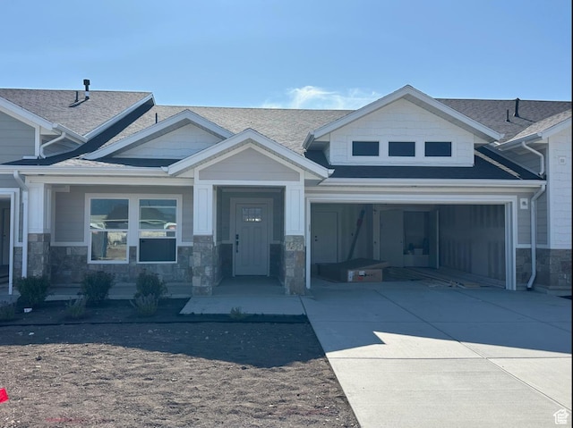 2655 S 2430 W Unit 116, Syracuse, UT 84075 - craftsman inspired home featuring concrete driveway, stone siding, and a shingled roof