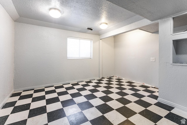 1844 Sorrento Dr, Woods Cross, UT 84087 - spare room with a textured ceiling, a textured wall, and tile patterned floors