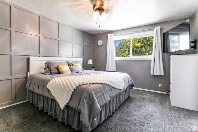 1844 Sorrento Dr, Woods Cross, UT 84087 - bedroom featuring dark colored carpet, a textured ceiling, and a ceiling fan