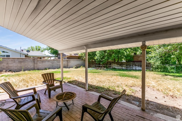 1844 Sorrento Dr, Woods Cross, UT 84087 - fenced backyard with a patio area and an outdoor fire pit