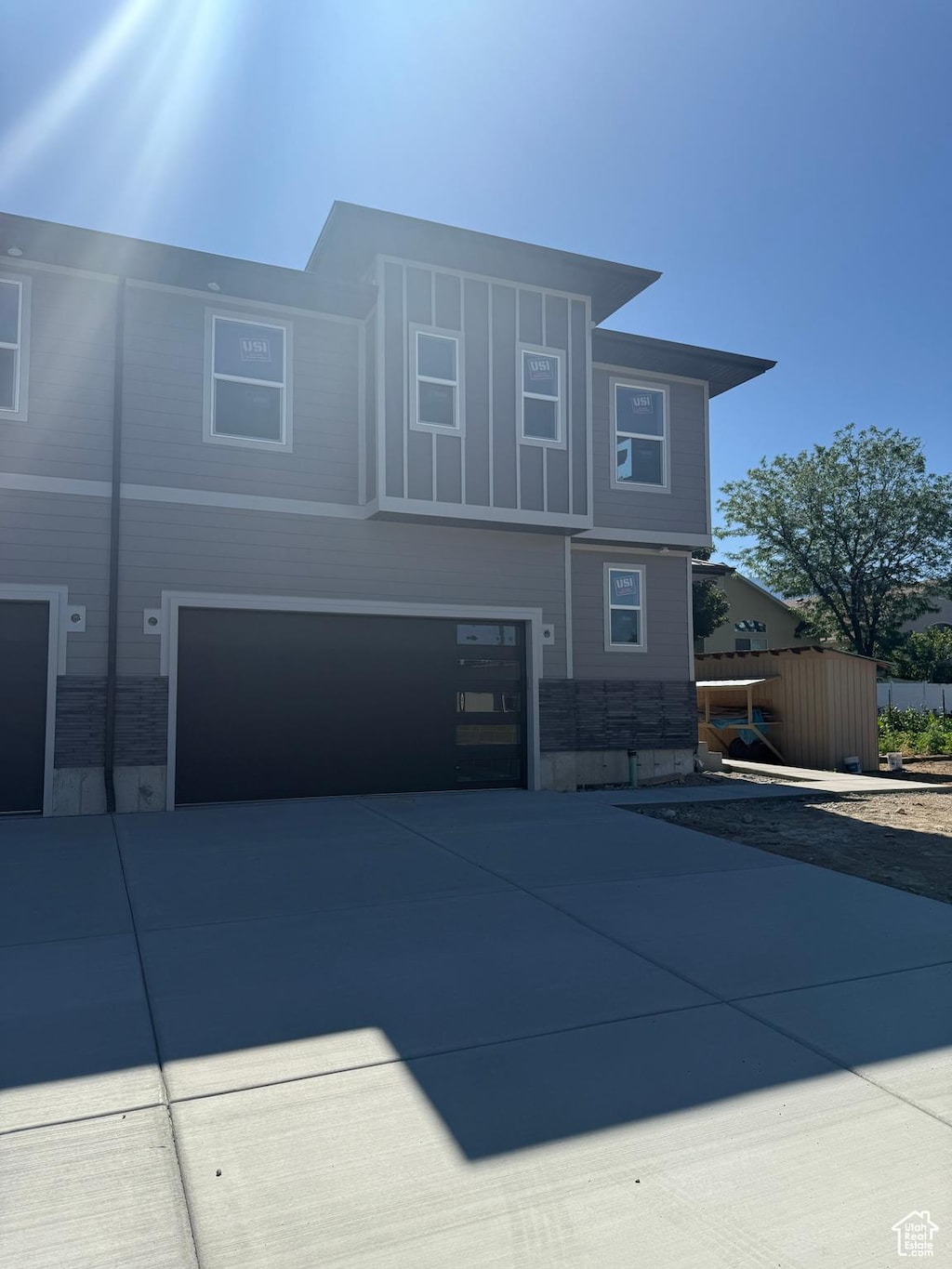 7433 S 410 E, Midvale, UT 84047 - view of front of property featuring concrete driveway and an attached garage