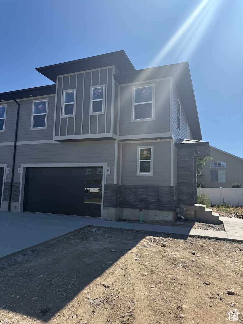 7433 S 410 E, Midvale, UT 84047 - view of front of property featuring concrete driveway and a garage