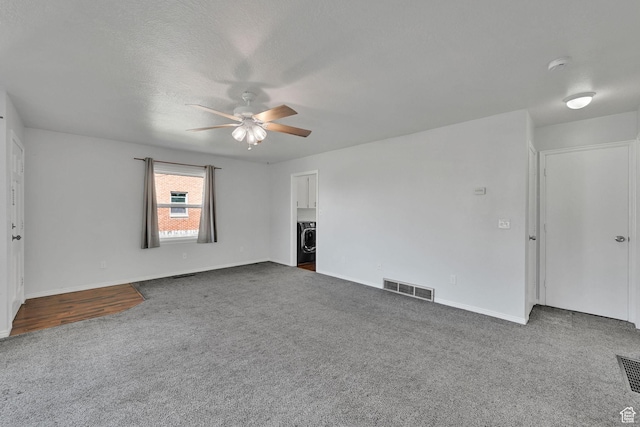 363 E Factory St, Garland, UT 84312 - unfurnished living room with carpet floors, a ceiling fan, and washing machine and clothes dryer