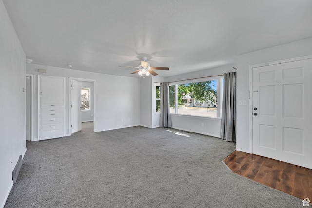 363 E Factory St, Garland, UT 84312 - unfurnished living room with ceiling fan and carpet flooring