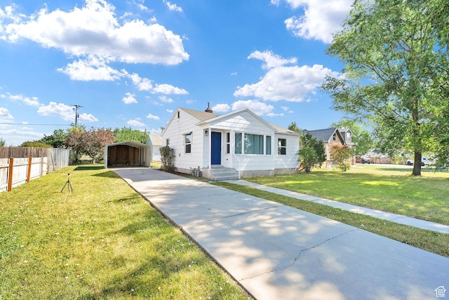 363 E Factory St, Garland, UT 84312 - view of front of home featuring a carport, driveway, and entry steps