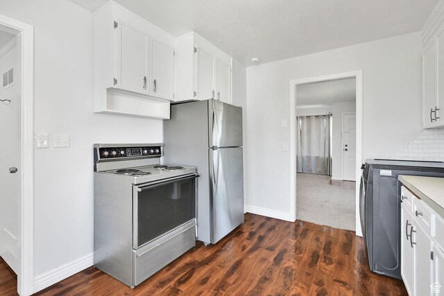 363 E Factory St, Garland, UT 84312 - kitchen with white electric range, white cabinets, and dark wood-style floors
