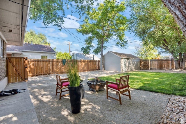 851 E Elm Ave, Salt Lake City, UT 84106 - fenced backyard with a patio, a fire pit, a storage shed, and a gate