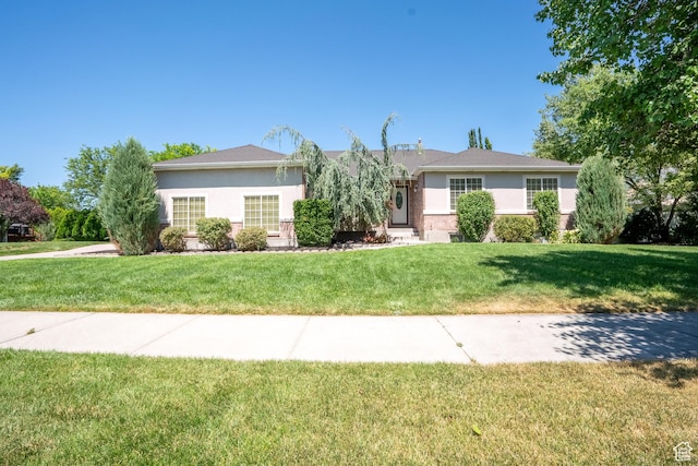 571 E Golden Pheasant Dr, Draper, UT 84020 - ranch-style house featuring a front lawn and stucco siding