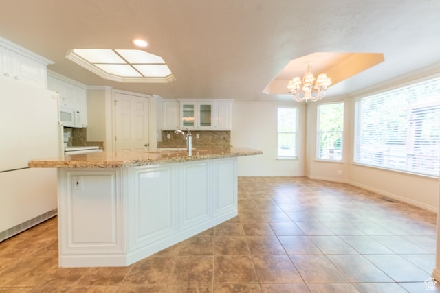 571 E Golden Pheasant Dr, Draper, UT 84020 - kitchen featuring a chandelier, tasteful backsplash, white appliances, white cabinetry, and glass insert cabinets