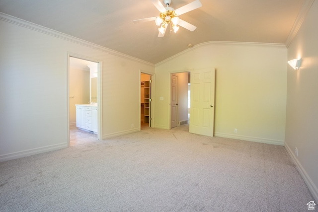 571 E Golden Pheasant Dr, Draper, UT 84020 - unfurnished bedroom with crown molding, vaulted ceiling, a walk in closet, light carpet, and connected bathroom