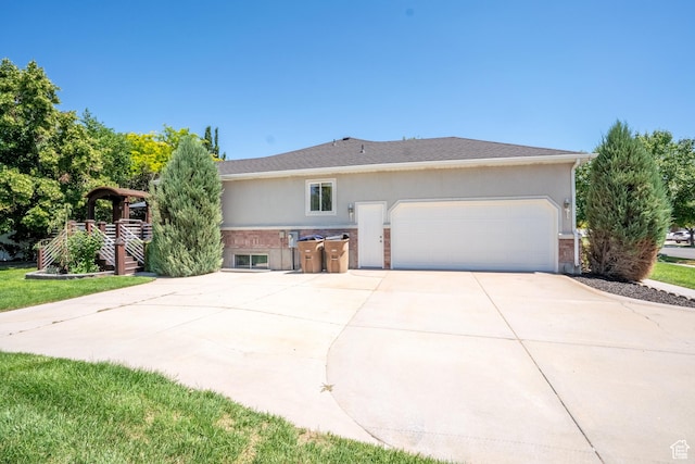 571 E Golden Pheasant Dr, Draper, UT 84020 - view of front of property featuring a garage, driveway, and stucco siding