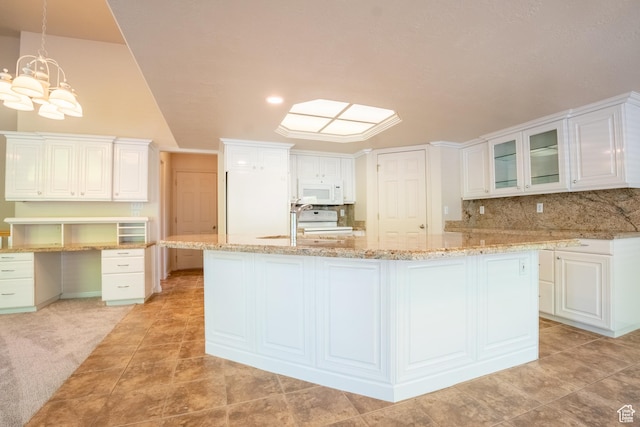 571 E Golden Pheasant Dr, Draper, UT 84020 - kitchen featuring white appliances, a large island, white cabinetry, and tasteful backsplash