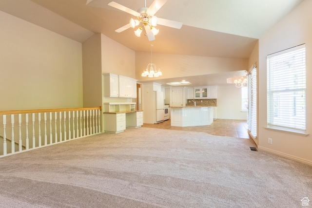 571 E Golden Pheasant Dr, Draper, UT 84020 - unfurnished living room with a chandelier, light carpet, a ceiling fan, and high vaulted ceiling