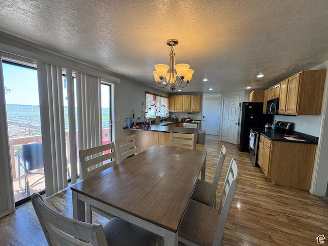 631 W Main St W, Wellington, UT 84542 - dining area with a chandelier, a textured ceiling, light wood-type flooring, and recessed lighting