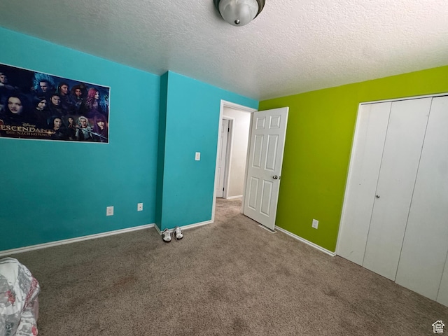 631 W Main St W, Wellington, UT 84542 - unfurnished bedroom featuring carpet floors, a textured ceiling, and a closet