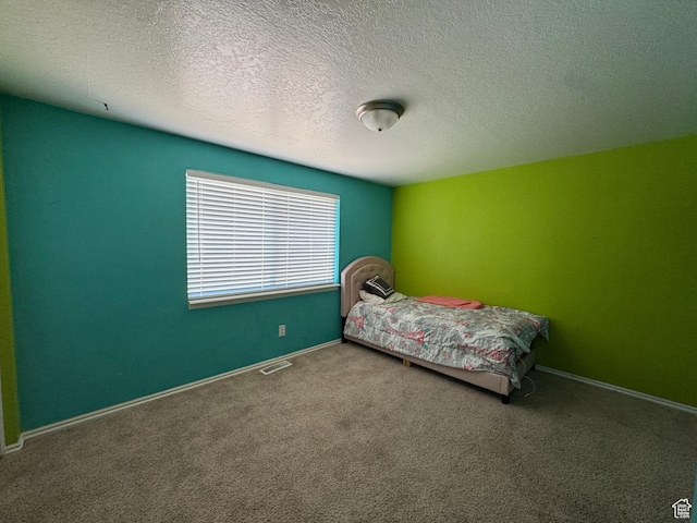 631 W Main St W, Wellington, UT 84542 - carpeted bedroom with baseboards and a textured ceiling