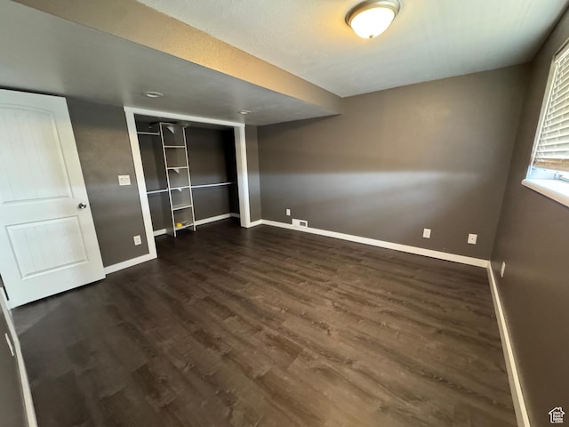 631 W Main St W, Wellington, UT 84542 - unfurnished bedroom featuring dark wood-style floors and a closet