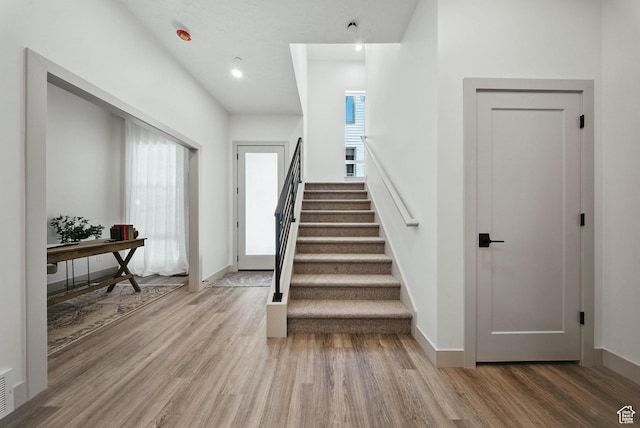 2009 E Beverly Dr S, Holladay, UT 84117 - staircase with wood finished floors and recessed lighting