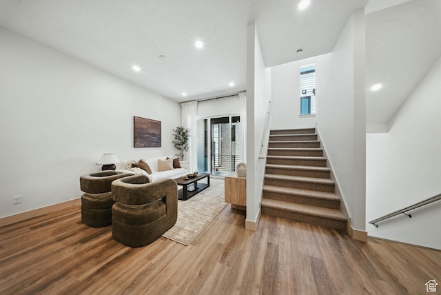 2009 E Beverly Dr S, Holladay, UT 84117 - living room featuring light wood-type flooring, stairs, and recessed lighting
