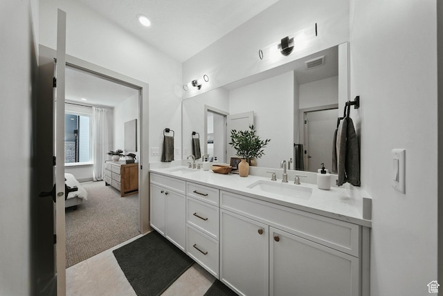 2009 E Beverly Dr S, Holladay, UT 84117 - full bathroom with double vanity, ensuite bath, and tile patterned floors