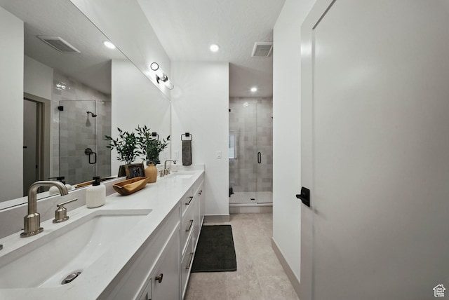 2009 E Beverly Dr S, Holladay, UT 84117 - bathroom featuring double vanity, a stall shower, recessed lighting, and tile patterned flooring