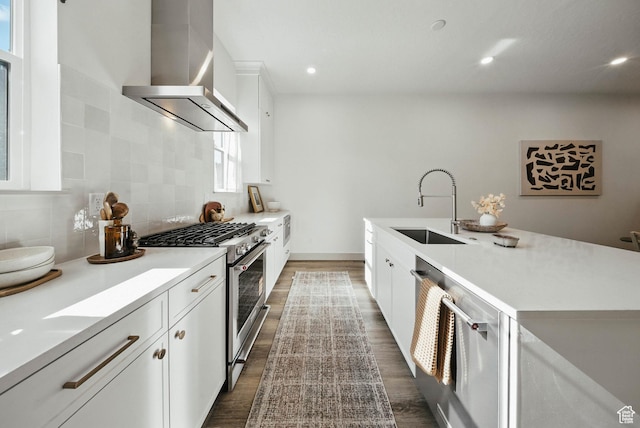 2009 E Beverly Dr S, Holladay, UT 84117 - kitchen featuring wall chimney range hood, high end stainless steel range, dark wood-style floors, light countertops, and decorative backsplash