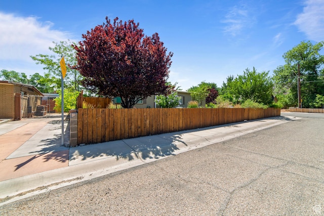 460 E Bowen Cir, Moab, UT 84532 - view of asphalt road featuring sidewalks, a gate, and curbs