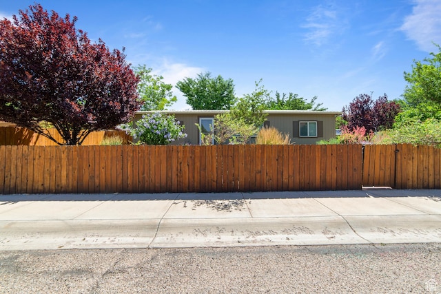 460 E Bowen Cir, Moab, UT 84532 - view of property hidden behind natural elements featuring a fenced front yard and a gate